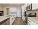 Bright kitchen featuring white cabinets and granite countertops at 8928 Morning Mist Rd, Charlotte, NC 28215