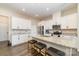 Spacious kitchen with island, white cabinets, and granite countertops at 8928 Morning Mist Rd, Charlotte, NC 28215