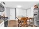 Kitchen with white cabinets, wood table and stainless steel appliances at 911 Elm St, Kannapolis, NC 28081