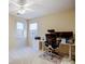 Bedroom featuring a ceiling fan, carpet, and two windows that allow for natural light at 1000 Weeping Willow Ln, Matthews, NC 28105