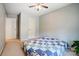 Comfortable bedroom featuring neutral walls, carpet, ceiling fan, and two closets at 1000 Weeping Willow Ln, Matthews, NC 28105