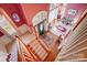 Foyer featuring stairs with wood and carpet trim and natural light coming from the windows at 1000 Weeping Willow Ln, Matthews, NC 28105