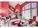 Spacious living room with staircase, vaulted ceilings, and large windows providing natural light at 1000 Weeping Willow Ln, Matthews, NC 28105