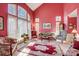 Inviting living room with a large window, comfortable seating, and a high ceiling at 1000 Weeping Willow Ln, Matthews, NC 28105