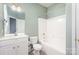 Clean bathroom with a bathtub and white vanity at 10318 Threatt Woods Dr, Charlotte, NC 28277