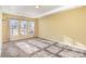 Well-lit bedroom with neutral walls and carpet flooring at 10318 Threatt Woods Dr, Charlotte, NC 28277