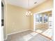 Sunlit dining area with access to a cozy sunroom at 10318 Threatt Woods Dr, Charlotte, NC 28277