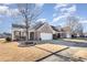 Brick ranch home with attached garage and mature tree at 10318 Threatt Woods Dr, Charlotte, NC 28277