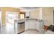 Kitchen with island, stainless steel appliances, and white cabinets at 10318 Threatt Woods Dr, Charlotte, NC 28277