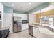 Kitchen with stainless steel appliances and white cabinets at 10318 Threatt Woods Dr, Charlotte, NC 28277