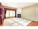 Bright living room with hardwood floors and a fireplace at 10318 Threatt Woods Dr, Charlotte, NC 28277