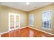 Home office with hardwood floors and window blinds at 10318 Threatt Woods Dr, Charlotte, NC 28277