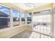 Sunroom with multiple windows and sliding glass door access to patio at 10318 Threatt Woods Dr, Charlotte, NC 28277