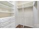 Large walk-in closet with built-in shelving and hanging space at 10318 Threatt Woods Dr, Charlotte, NC 28277