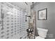 Modern bathroom with a star patterned shower and a wooden ladder towel rack at 11532 Delores Ferguson Ln # 1004, Charlotte, NC 28277