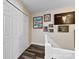 Upper hallway with double doors and gallery wall featuring framed artwork at 11532 Delores Ferguson Ln # 1004, Charlotte, NC 28277