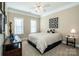 Comfortable bedroom with ceiling fan and neutral decor at 11925 Lawings Corner Dr, Huntersville, NC 28078