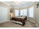 Bright bedroom with bay window, carpet, and double door closet at 11925 Lawings Corner Dr, Huntersville, NC 28078