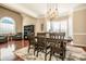 Spacious dining room with hardwood floors, large windows and elegant light fixture at 11925 Lawings Corner Dr, Huntersville, NC 28078