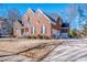 Brick home with a side view showing a driveway and attached garage at 11925 Lawings Corner Dr, Huntersville, NC 28078