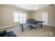 Finished basement with ping pong table at 11925 Lawings Corner Dr, Huntersville, NC 28078