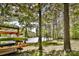 Kayaks stored near the lake with wooded shoreline at 11925 Lawings Corner Dr, Huntersville, NC 28078