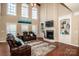 Two-story living room with fireplace and hardwood floors at 11925 Lawings Corner Dr, Huntersville, NC 28078