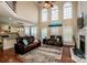 Two-story living room with fireplace and hardwood floors at 11925 Lawings Corner Dr, Huntersville, NC 28078