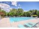 Inviting community pool with lounge chairs and shaded areas at 11925 Lawings Corner Dr, Huntersville, NC 28078