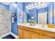 Double vanity bathroom with blue walls and shower at 13026 Serenity St, Huntersville, NC 28078