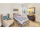 Cozy bedroom with twin bed, armchair, and dresser at 13026 Serenity St, Huntersville, NC 28078