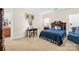 Comfortable bedroom with a desk and en-suite bathroom access at 13026 Serenity St, Huntersville, NC 28078