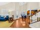 Bright dining area with hardwood floors and access to the kitchen at 13026 Serenity St, Huntersville, NC 28078