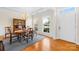 Formal dining room featuring hardwood floors and a wooden table set at 13026 Serenity St, Huntersville, NC 28078