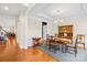 Spacious dining room with hardwood floors, and wooden table set at 13026 Serenity St, Huntersville, NC 28078