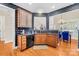 Modern kitchen with granite countertops and black appliances at 13026 Serenity St, Huntersville, NC 28078