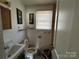 Clean bathroom with a toilet, sink, and bathtub at 1418 Winston Dr, Charlotte, NC 28205