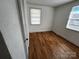 Bright bedroom with wood-look floors and large windows at 1418 Winston Dr, Charlotte, NC 28205