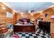 Basement bedroom with wood walls and a checkered floor at 148 Shawver Ln, Statesville, NC 28625