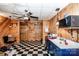 Basement kitchenette with blue cabinets and checkerboard floor at 148 Shawver Ln, Statesville, NC 28625