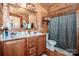 Main bathroom with double vanity and shower at 148 Shawver Ln, Statesville, NC 28625