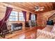 Cozy bonus room features wood walls, large windows, and hardwood floors at 148 Shawver Ln, Statesville, NC 28625