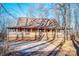 Rustic log cabin home with wraparound porch and large yard at 148 Shawver Ln, Statesville, NC 28625