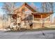 Rustic two-story log home with wrap-around porch at 148 Shawver Ln, Statesville, NC 28625