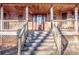 Inviting front entrance with wooden stairs and porch at 148 Shawver Ln, Statesville, NC 28625