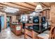 Log cabin kitchen with island, double ovens, and wood cabinets at 148 Shawver Ln, Statesville, NC 28625