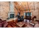 Living room with a large stone fireplace and hardwood floors at 148 Shawver Ln, Statesville, NC 28625