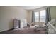 Well-lit Bedroom featuring a crib, dresser, and rocking chair at 1585 Whitman Ct, York, SC 29745