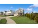 Two-story house with gray siding, stone accents, and a two-car garage at 1585 Whitman Ct, York, SC 29745