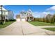 Two-story house with gray siding, stone accents, and a two-car garage at 1585 Whitman Ct, York, SC 29745